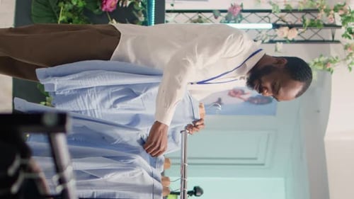 Vertical Video Man Restocks Luxurious Clothing Store