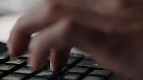 Closeup Hand Using Calculator Detailed View of Bookkeeper Reviewing Receipts