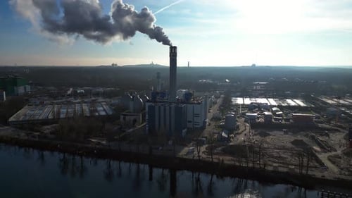 Waste energy plant factory with smoke chimney. Stunning aerial view flight drone