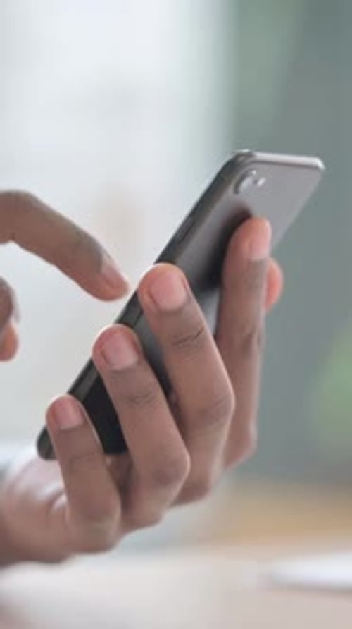 Close up of African Man Using Smartphone, Vertical Video