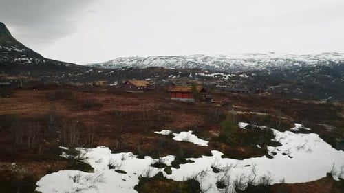 Traditional Norwegian Houses Nestled in Mountainous Valley