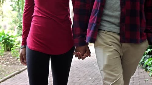 4k Video footage of a young couple enjoying a romantic afternoon in a park together