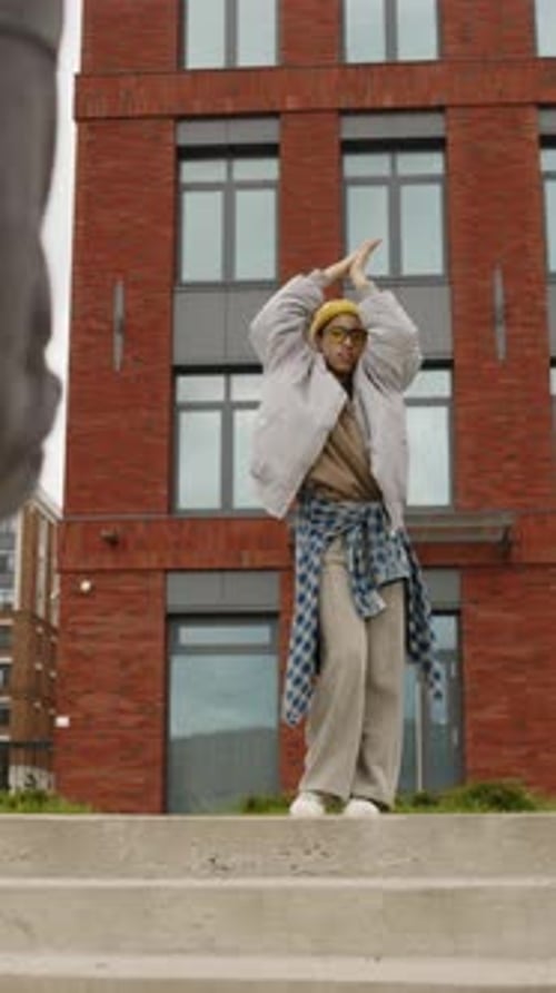 Young Adult Dancing on Stairs in City