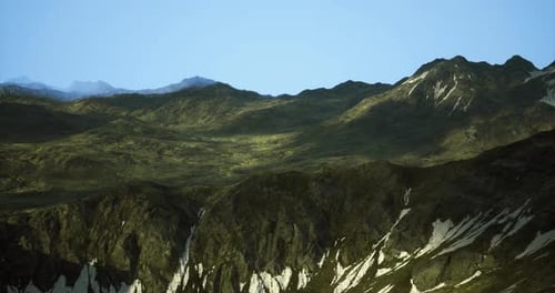 Majestic Mountains Showcasing Vibrant Green Valleys Under Clear Sky