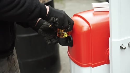 Electrician connects the yellow Signal Lamp for the gate. Warning yellow flash lamp