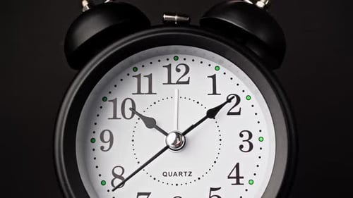 Striking Black Clock Elegantly Ticks in Dark Setting Marking Time Time Moving