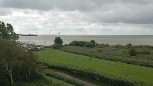 Aerial view of kitesurfing extreme sport with the wind at lake, Netherlands