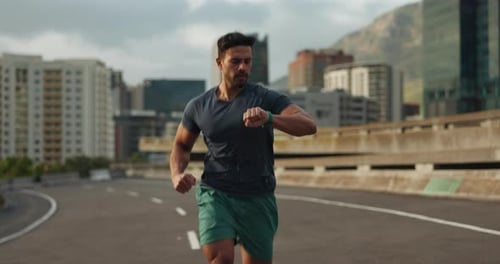Sports, running and fitness man in a city street for marathon, training or performance