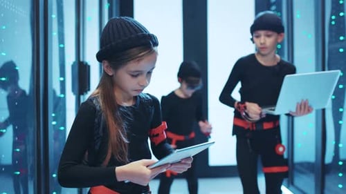 A Group of Young Tech Innovators Works Together in a Cuttingedge and Futuristic Server Room