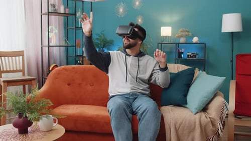 Man Using Virtual Reality Headset at Home