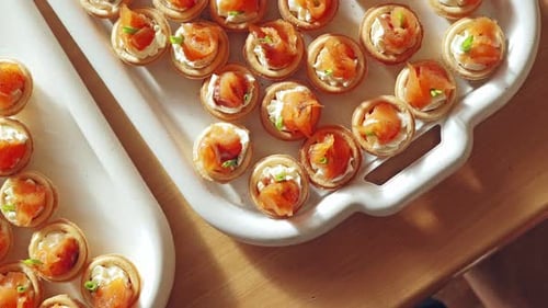 Salmon Tartlets with Cream Cheese and Herbs on White Tray - Gourmet Appetizers