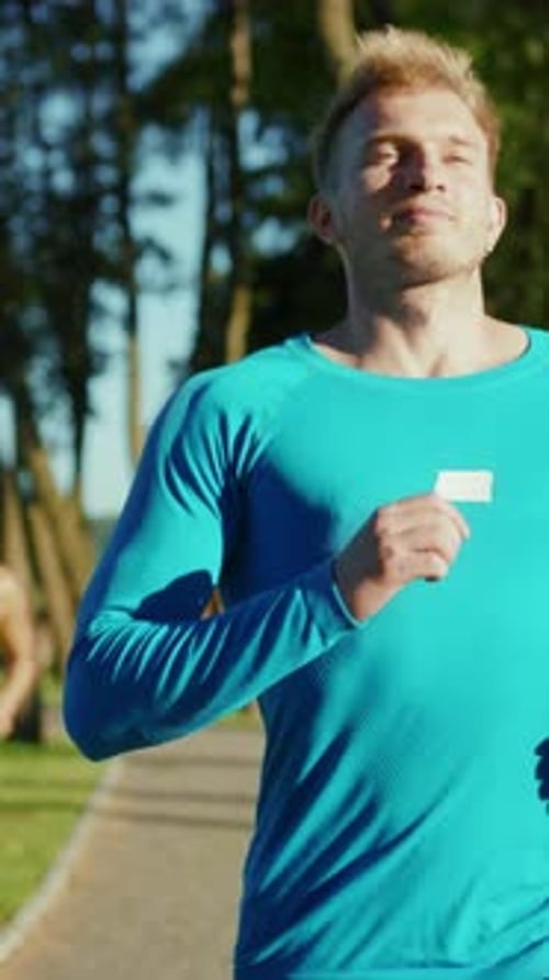 Man Jogging Along a Path in the Daytime