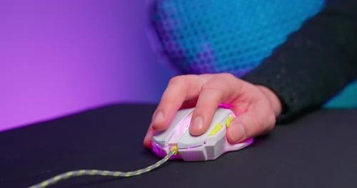Hand Using Glowing Computer Gaming Mouse