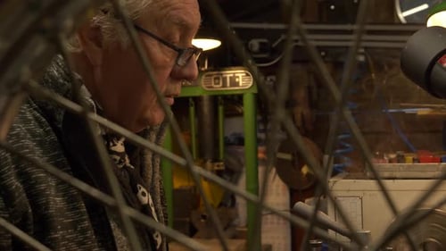 Senior Man Working on Machine in Workshop