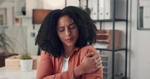 Creative, woman and massage shoulder pain in office from bad posture, muscle strain and burnout