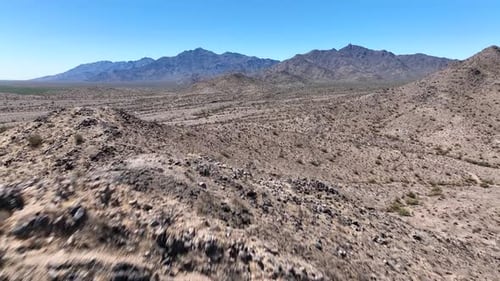 Aerial view of desert landscape with mountains, United States.