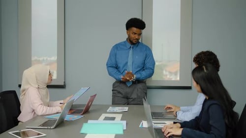 Presentation by Man to Colleagues in Office