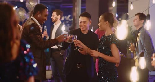 Friends Toast at Lively Evening Party in City