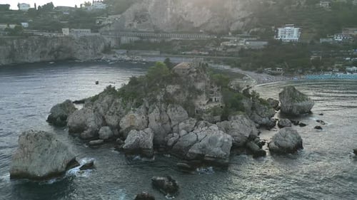 4K Aerial of Isola Bella at Sunset, in Taormina, Sicily in July 2025