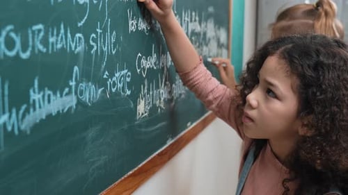 Student study coding engineering prompt while writing at blackboard. Pedagogy.