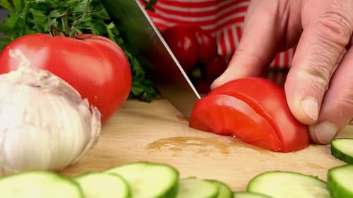 Tomato Being Sliced for Vegetable Preparation