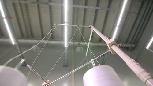 Thread Spools on Automated Textile Machine in Factory