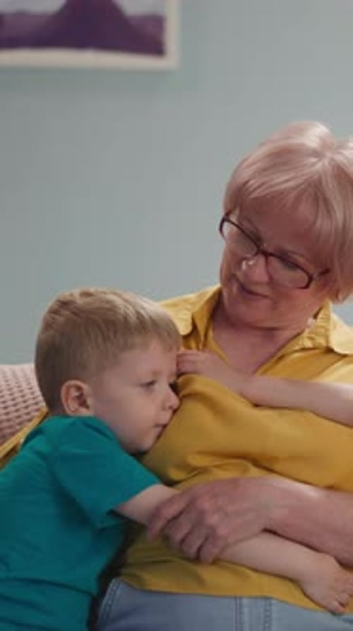 Grandmother Hugs Grandchildren in a Cozy Home