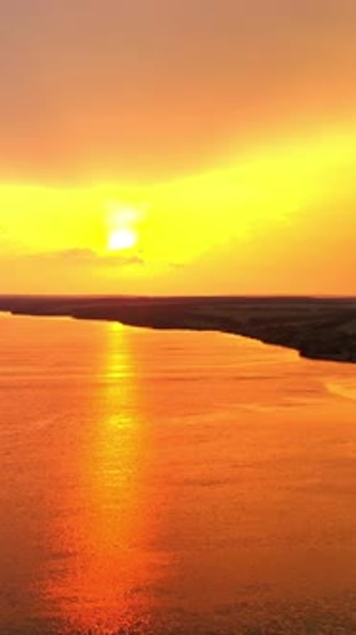 Aerial landscape with sunset view over the river. Beautiful evening river with sun reflection.