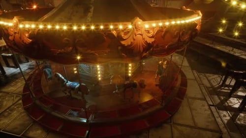 Empty Amusement Park at Night Featuring a Lit Carousel and Vacant Rides