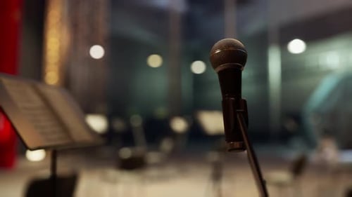 Microphone and Music Stand on Empty Stage