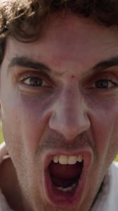 Man Yelling and Looking at Camera in Portrait