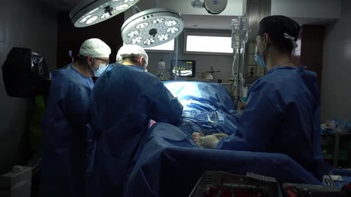Surgical Team Performing Operation in Hospital Operating Room