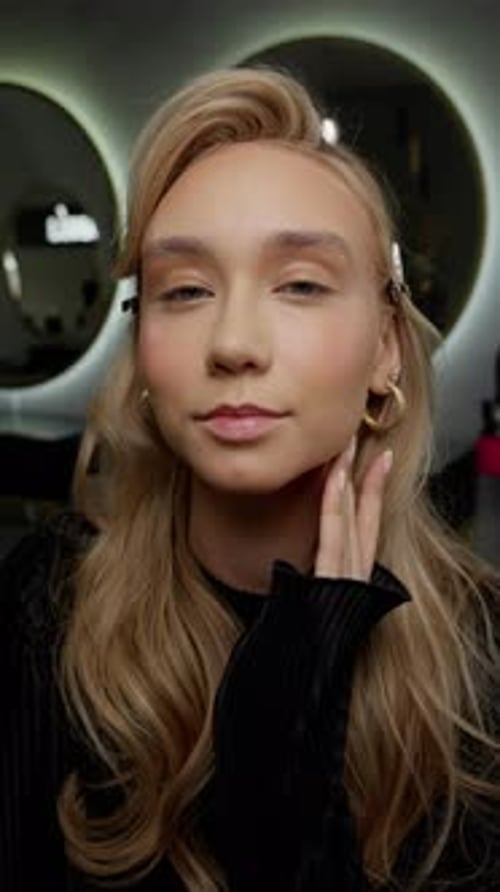 Woman Posing and Smiling in Front of Mirrors