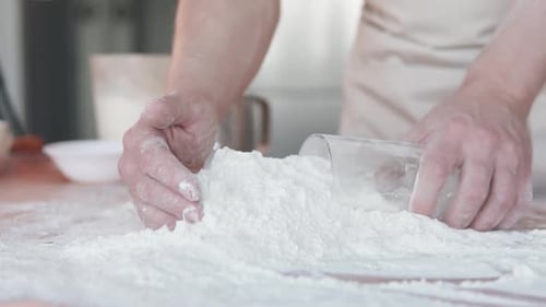 Hands Kneading Flour on Wooden Surface for Baking