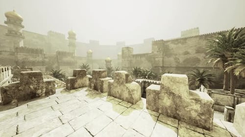 Ancient Fortress Courtyard with Palm Trees Under Misty Sky
