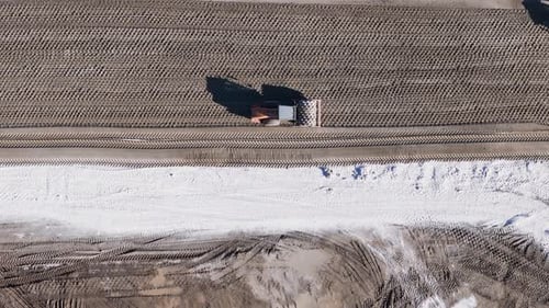 Top Down View of the Roller is Rolling Sand During the Construction
