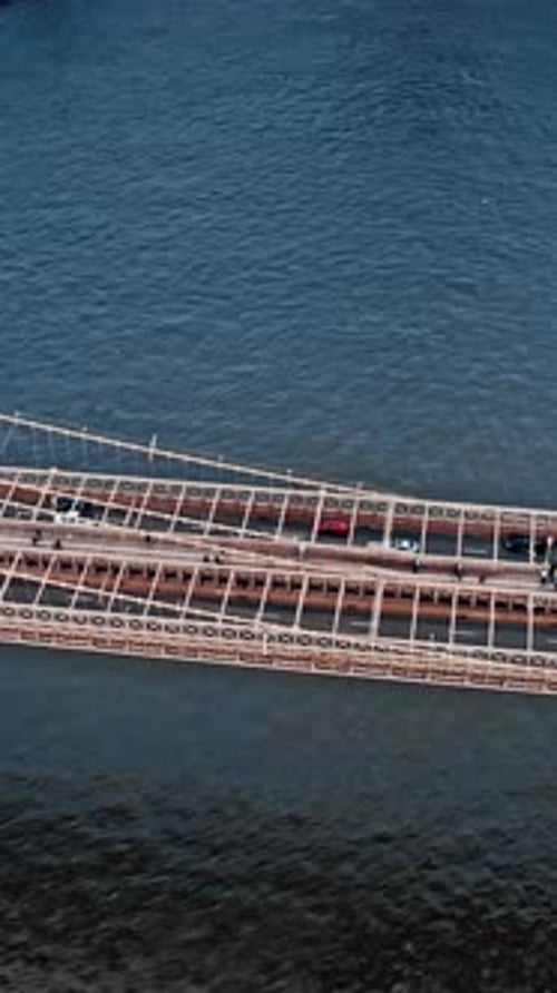 Aerial view captures Brooklyn Bridge over water in New York City