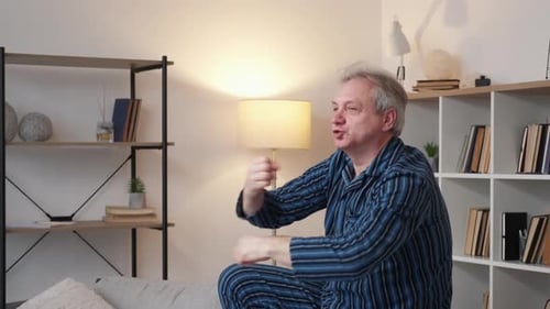 Excited Man in Pajamas Dances with Joy