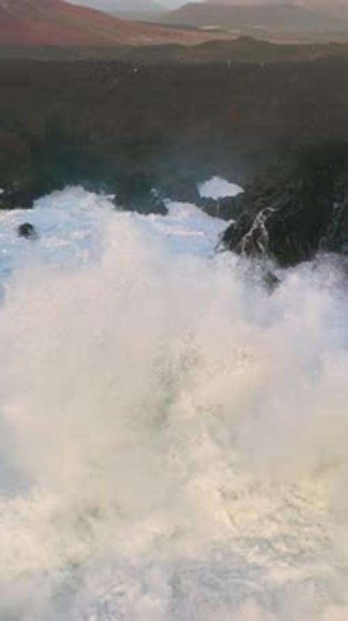 Vertical Aerial Top View Footage of Fabulous Sea Tide on a Stormy Day Drone Filming Breaking Surf