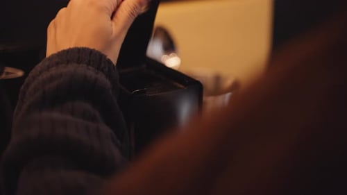 Hands Preparing Coffee with Capsule Machine at Home