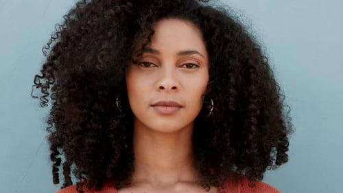 Portrait of a Young Woman with Curly Hair