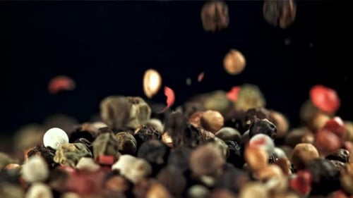 Colourful Peppercorns Falling in Slow Motion
