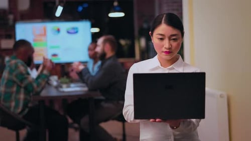 Asian Businesswoman Working on Laptop Smiling Portrait Front View
