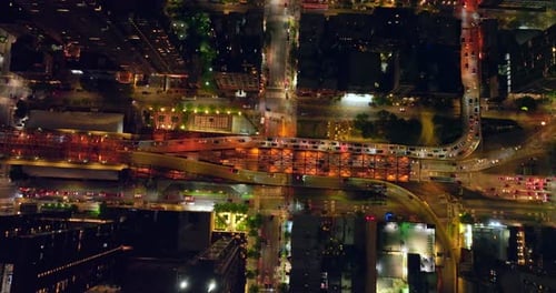 Flight over the Queensboro bridge with busy traffic.