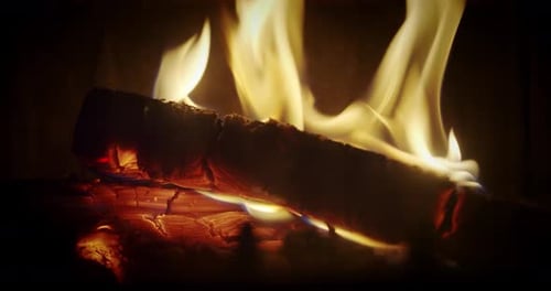 Wood Fire Burning in a Dark Fireplace