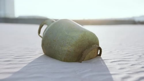 Old Rusted Metal Gas Tank on the Beach