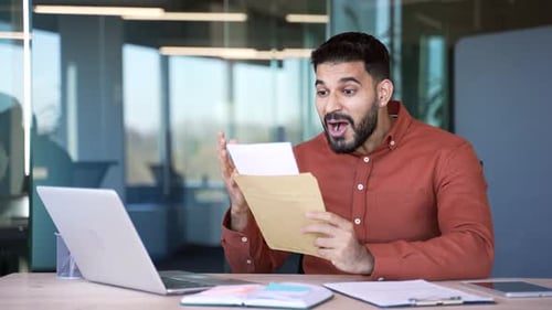 Man Receives Good News in Office Environment