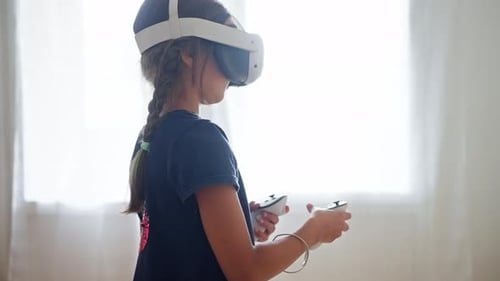 Girl Experiencing Virtual Reality with Headset and Controllers