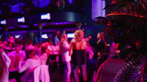 Crowded Night Club Scene with Dancing Adults