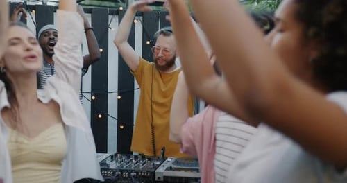 Friends Enjoying Party With a DJ Outdoors